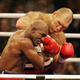 Illustration for article titled Holyfield Loses Narrow Decision, Survives